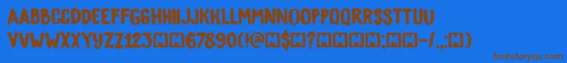 フォントDkBygone – 茶色の文字が青い背景にあります。