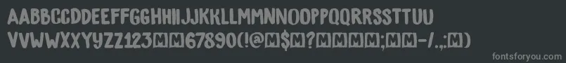 フォントDkBygone – 黒い背景に灰色の文字