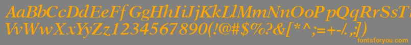 フォントOrchidsskSemibolditalic – オレンジの文字は灰色の背景にあります。