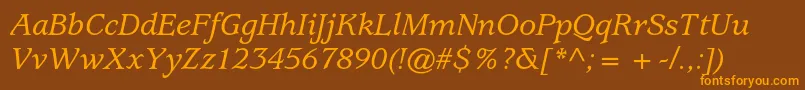 フォントUsherwoodstdMediumitalic – オレンジ色の文字が茶色の背景にあります。