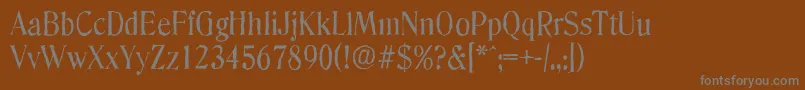 DenverantiqueRegular-fontti – harmaat kirjasimet ruskealla taustalla