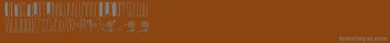 Czcionka BillybopMinuskuli – szare czcionki na brązowym tle
