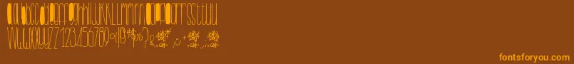 fuente BillybopMinuskuli – Fuentes Naranjas Sobre Fondo Marrón