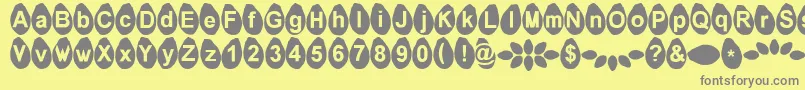 Melonseeds-fontti – harmaat kirjasimet keltaisella taustalla