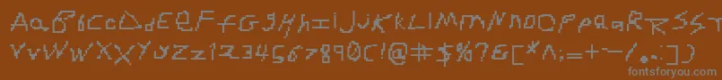 RdjHandpixl Font – Gray Fonts on Brown Background