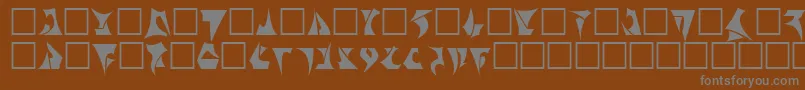 Klinzhai-fontti – harmaat kirjasimet ruskealla taustalla