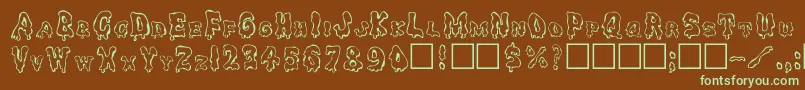 フォントGhouly – 緑色の文字が茶色の背景にあります。