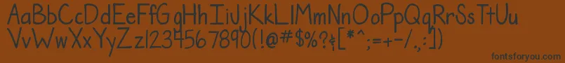 フォントDjbTheTeacherFont – 黒い文字が茶色の背景にあります