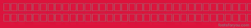 Fonte DelongbaEngraved – fontes cinzas em um fundo vermelho