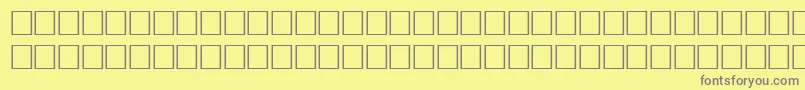 DelongbaEngraved-Schriftart – Graue Schriften auf gelbem Hintergrund