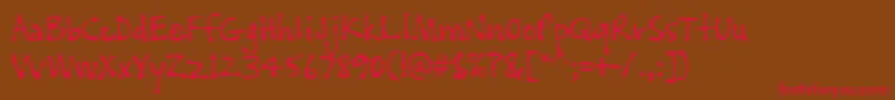 PftissueRegular Font – Red Fonts on Brown Background