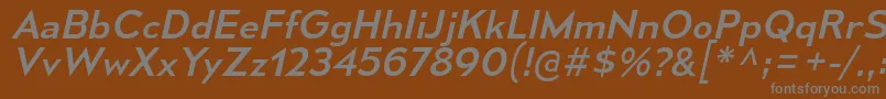 MesmerizeSeRgIt-fontti – harmaat kirjasimet ruskealla taustalla