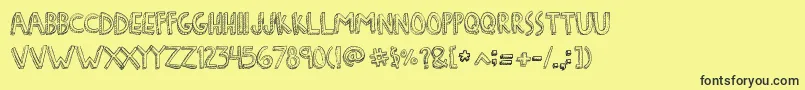 DenneFreakshow-Schriftart – Schwarze Schriften auf gelbem Hintergrund