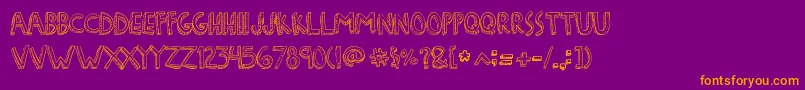 DenneFreakshow Font – Orange Fonts on Purple Background