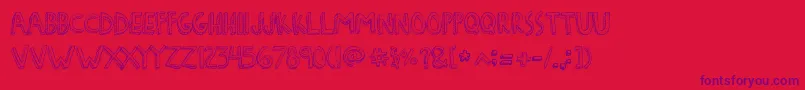 DenneFreakshow Font – Purple Fonts on Red Background