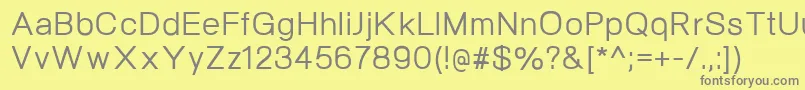NeogramMedium-fontti – harmaat kirjasimet keltaisella taustalla