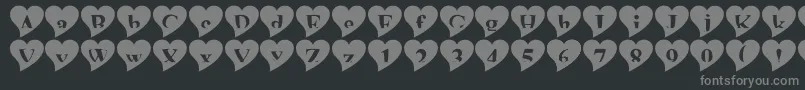 Mashyval-fontti – harmaat kirjasimet mustalla taustalla