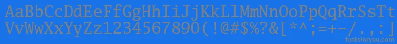 Luximr-fontti – harmaat kirjasimet sinisellä taustalla