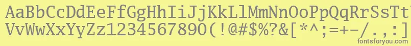 Luximr-fontti – harmaat kirjasimet keltaisella taustalla