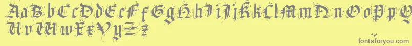 フォントSatanasHumanumSalvator – 黄色の背景に灰色の文字