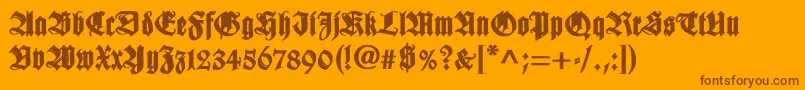 WilhelmklingsporgotischBold-Schriftart – Braune Schriften auf orangefarbenem Hintergrund