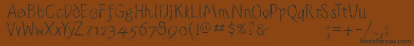 Sketchedalphabet-fontti – mustat fontit ruskealla taustalla