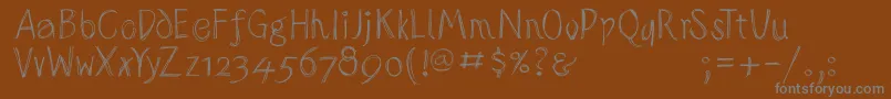 Police Sketchedalphabet – polices grises sur fond brun