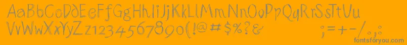 Sketchedalphabet-fontti – harmaat kirjasimet oranssilla taustalla