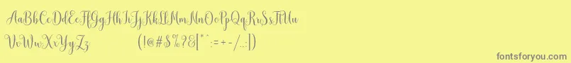 MudhisaScriptDemo Font – Gray Fonts on Yellow Background