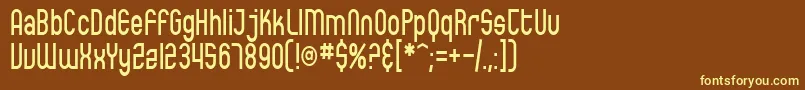 SfEccentricOpusCondensed-fontti – keltaiset fontit ruskealla taustalla
