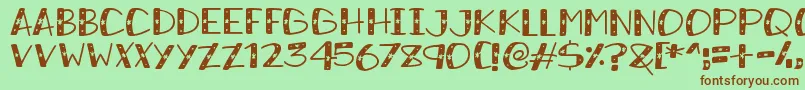 SnowySparkles Font – Brown Fonts on Green Background