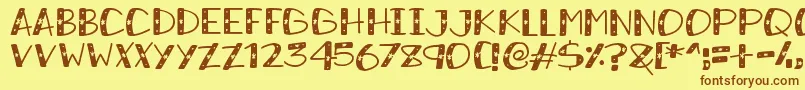 SnowySparkles Font – Brown Fonts on Yellow Background