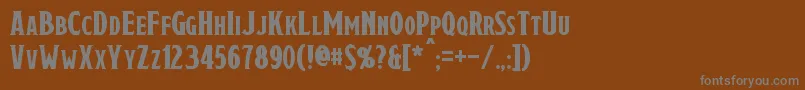 Draconis-fontti – harmaat kirjasimet ruskealla taustalla