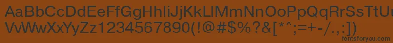 Pragmaticamacctt-Schriftart – Schwarze Schriften auf braunem Hintergrund