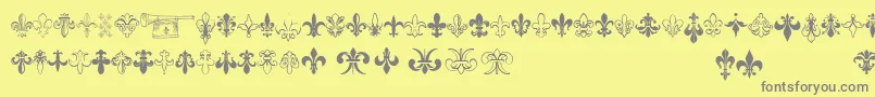 Thefrench-fontti – harmaat kirjasimet keltaisella taustalla