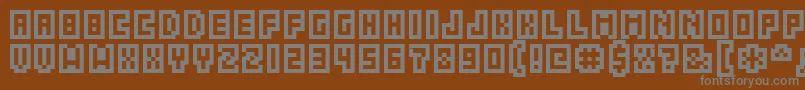 GrixelAcme5Compcapso Font – Gray Fonts on Brown Background