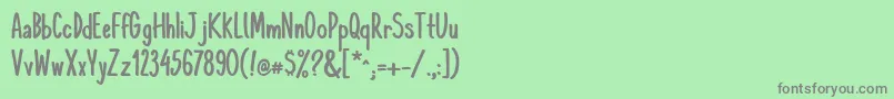 フォントKomixconBold – 緑の背景に灰色の文字