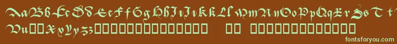 フォントBatarde – 緑色の文字が茶色の背景にあります。