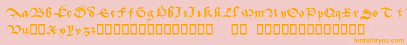 フォントBatarde – オレンジの文字がピンクの背景にあります。