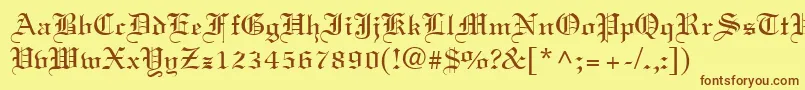 フォントOldtext – 茶色の文字が黄色の背景にあります。