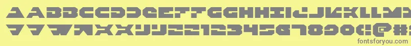 Triggermanexpand-Schriftart – Graue Schriften auf gelbem Hintergrund