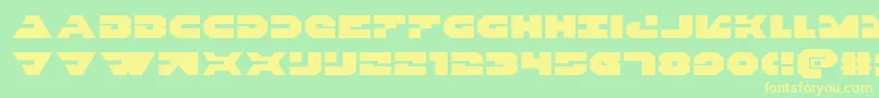 フォントTriggermanexpand – 黄色の文字が緑の背景にあります