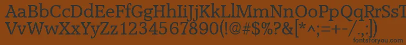 AccoladeRegular-fontti – mustat fontit ruskealla taustalla