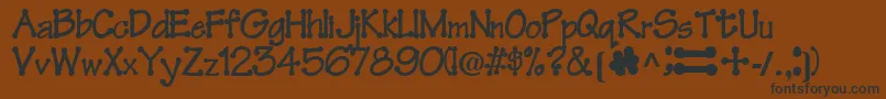 FeltRegularTtnorm Font – Black Fonts on Brown Background