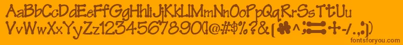 FeltRegularTtnorm-Schriftart – Braune Schriften auf orangefarbenem Hintergrund