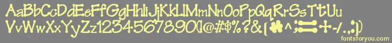 FeltRegularTtnorm-Schriftart – Gelbe Schriften auf grauem Hintergrund