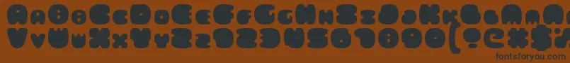 FatsAreGood-Schriftart – Schwarze Schriften auf braunem Hintergrund