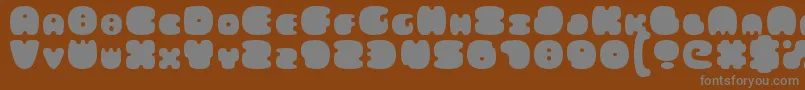FatsAreGood-fontti – harmaat kirjasimet ruskealla taustalla