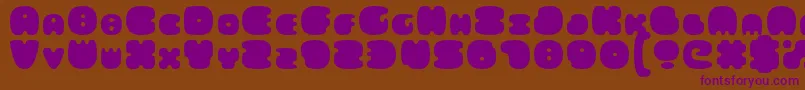 FatsAreGood-Schriftart – Violette Schriften auf braunem Hintergrund