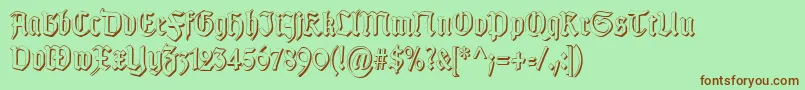 Fonte TypographergotischSchattenS – fontes marrons em um fundo verde